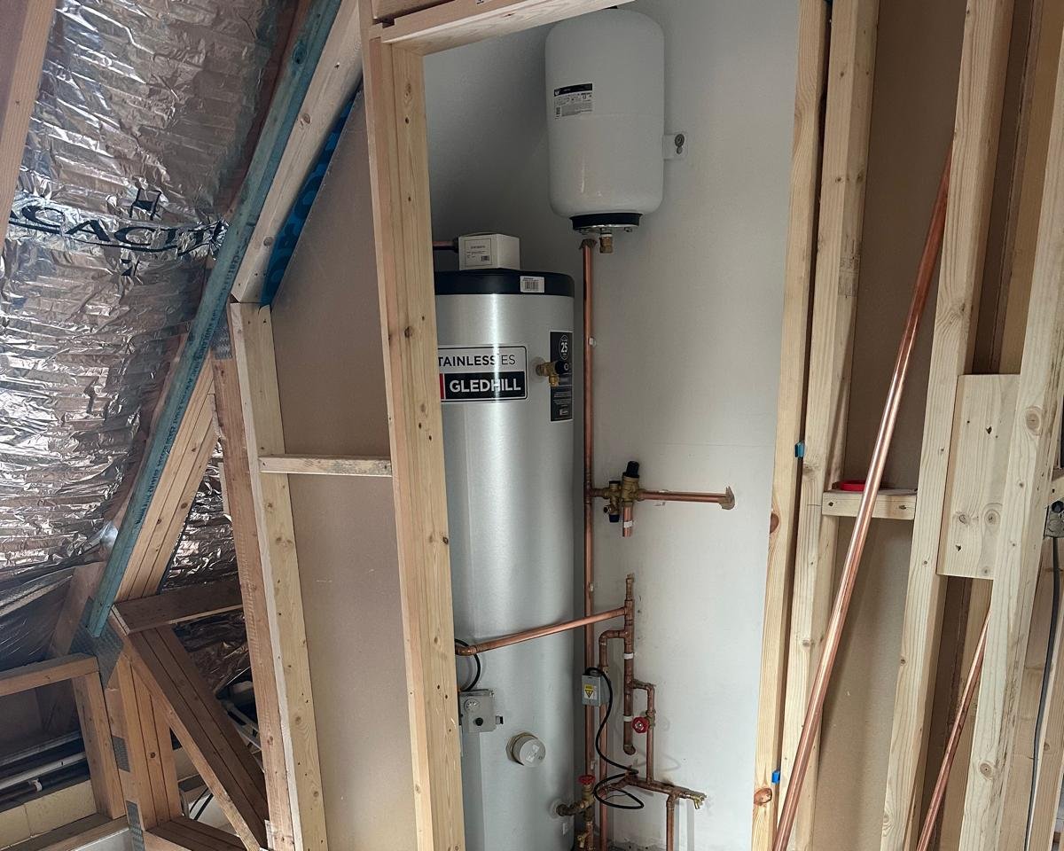 Gledhill unvented hot water cylinder installed in a loft cupboard