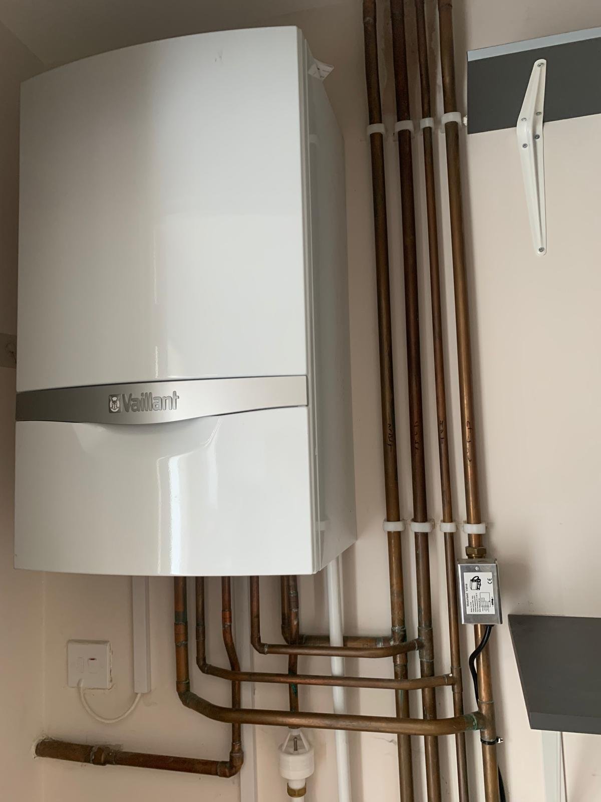 Vaillant combi boiler installed with clipped copper pipework by A S Plumbing and Heating in Northamptonshire